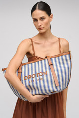 Profile view of model wearing the Oroton Ellis Canvas Medium Tote in Natural / Blue Stripe and Canvas for Women