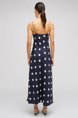 Profile view of model wearing the Oroton Starburst Spot Slip Dress in North Sea and 100% SILK for Women