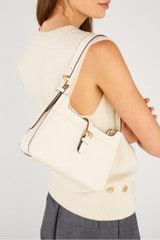 Profile view of model wearing the Oroton Dylan Baguette in Cream and Pebble Leather for Women