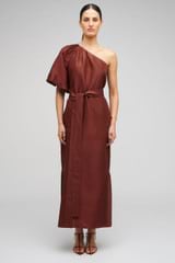 Profile view of model wearing the Oroton One Shoulder Dress in Barn Red and 100% Silk for Women