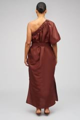 Profile view of model wearing the Oroton One Shoulder Dress in Barn Red and 100% Silk for Women