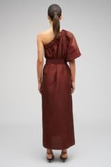 Profile view of model wearing the Oroton One Shoulder Dress in Barn Red and 100% Silk for Women