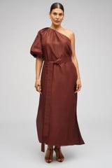 Profile view of model wearing the Oroton One Shoulder Dress in Barn Red and 100% Silk for Women