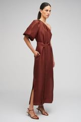 Profile view of model wearing the Oroton One Shoulder Dress in Barn Red and 100% Silk for Women