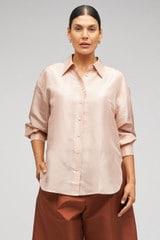 Profile view of model wearing the Oroton Ls Silk Shirt in Pale Rosewood and 100% Silk for Women