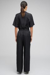 Profile view of model wearing the Oroton Spot Print Pj Pant in Black/Cream and 100% Silk for Women