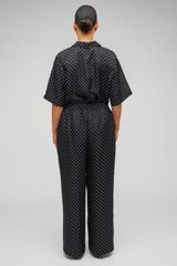 Profile view of model wearing the Oroton Spot Print Pj Pant in Black/Cream and 100% Silk for Women