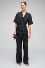 Profile view of model wearing the Oroton Spot Print Pj Pant in Black/Cream and 100% Silk for Women