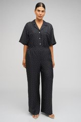 Profile view of model wearing the Oroton Spot Print Pj Pant in Black/Cream and 100% Silk for Women