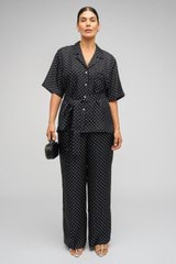 Profile view of model wearing the Oroton Spot Print Pj Pant in Black/Cream and 100% Silk for Women