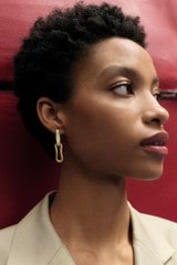 Profile view of model wearing the Oroton Livia Enamel Drop Earring in Worn Gold/Antique White and  for Women