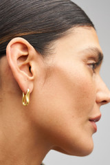 Profile view of model wearing the Oroton Livia Drop Earring in Worn Gold and  for Women