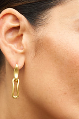 Profile view of model wearing the Oroton Livia Drop Earring in Worn Gold and  for Women