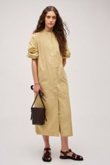 Profile view of model wearing the Oroton Cleo Poplin Dress in Wheat and 100% Cotton Poplin for Women