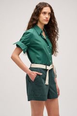 Profile view of model wearing the Oroton Wren Poplin Shirt in Villa Green and Made from 100% poplin cotton  for Women