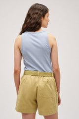 Profile view of model wearing the Oroton Lottie Rib Tank in Denim Blue and 92% Cotton / 8% Spandex for Women