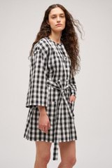 Profile view of model wearing the  Gingham Popover Dress in Black and High-quality fabric woven in Japan  for Men