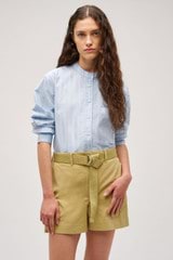 Profile view of model wearing the  Yarn Dyed Stripe Shirt in Denim Blue and Made from 100% cotton  for Men