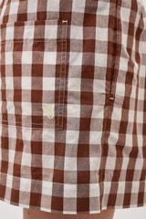 Profile view of model wearing the  Gingham Boxer Short in Chocolate and 100% Cotton for Men