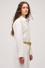 Profile view of model wearing the Oroton Wren Poplin Shirt in Antique White and Made from 100% poplin cotton  for Women