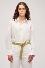 Profile view of model wearing the Oroton Wren Poplin Shirt in Antique White and Made from 100% poplin cotton  for Women