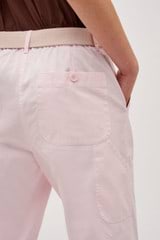 Profile view of model wearing the Oroton Arlo Carpenter Chino in Palest Pink and 100% Cotton for Women