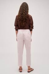 Profile view of model wearing the Oroton Arlo Carpenter Chino in Palest Pink and 100% Cotton for Women