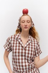 Profile view of model wearing the Oroton Gingham Camp Shirt in Chocolate and 100% Cotton for Women