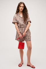 Profile view of model wearing the Oroton Gingham Camp Shirt in Chocolate and 100% Cotton for Women