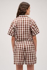 Profile view of model wearing the Oroton Gingham Camp Shirt in Chocolate and 100% Cotton for Women