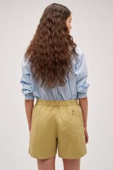 Profile view of model wearing the  Alfie Carpenter Short in Wheat and Crafted from cotton twill  for Men