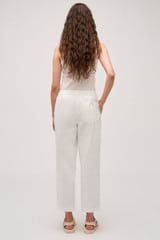 Profile view of model wearing the Oroton Arlo Carpenter Chino in Antique White and 100% Cotton for Women