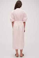 Profile view of model wearing the Oroton Cleo Poplin Dress in Palest Pink and 100% Cotton Poplin for Women