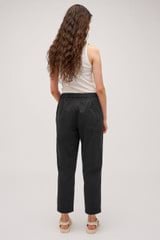 Profile view of model wearing the Oroton Arlo Carpenter Chino in Washed Black and 100% Cotton for Women