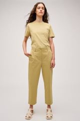 Profile view of model wearing the Oroton Arlo Carpenter Chino in Wheat and 100% Cotton for Women