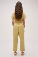 Profile view of model wearing the Oroton Arlo Carpenter Chino in Wheat and 100% Cotton for Women