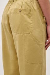 Profile view of model wearing the Oroton Arlo Carpenter Chino in Wheat and 100% Cotton for Women