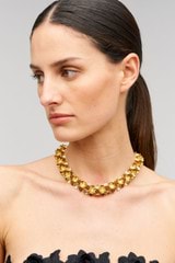 Profile view of model wearing the Oroton Flora Necklace in Worn Gold and Vintage Austrian Crystal, Brown Moonstone Semi-Precious stone paste for Women