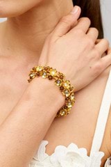 Profile view of model wearing the Oroton Flora Bracelet in Worn Gold and Vintage Austrian Crystal, Brown Moonstone Semi-Precious stone paste for Women