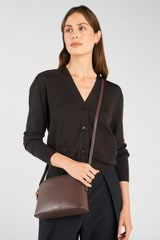 Profile view of model wearing the Oroton Inez Slim Crossbody in Coffee Bean and Shiny Soft Saffiano exterior for Women