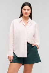 Profile view of model wearing the Oroton Wren Poplin Shirt in Palest Pink and Made from 100%  Cotton Poplin for Women