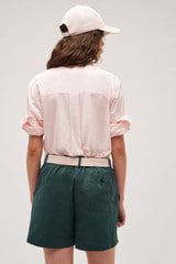 Profile view of model wearing the Oroton Wren Poplin Shirt in Palest Pink and Made from 100%  Cotton Poplin for Women