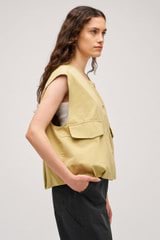 Profile view of model wearing the  Cotton Twill Vest in  and  for Women