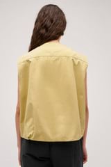 Profile view of model wearing the  Cotton Twill Vest in  and  for Women