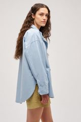 Profile view of model wearing the  Cotton Cagoule in Denim Blue and  for Women