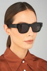 Profile view of model wearing the Oroton Selma Sunglasses in Signature Tort and Frame Made From Biodegradeable Acetate (Bioa) for Women