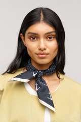 Profile view of model wearing the Oroton Mini Dot Cotton Bandana in  and Made from 100% cotton voile  for Women