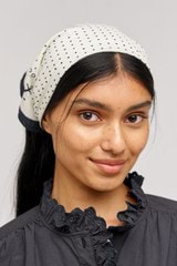 Profile view of model wearing the Oroton Mini Dot Cotton Bandana in Ecru and Made from 100% cotton voile  for Women