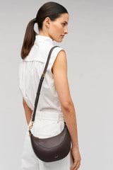 Profile view of model wearing the Oroton Florence Small Shoulder Bag in Mahogany and  for Women