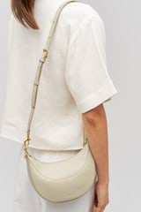 Profile view of model wearing the Oroton Florence Small Shoulder Bag in Laurel and  for Women